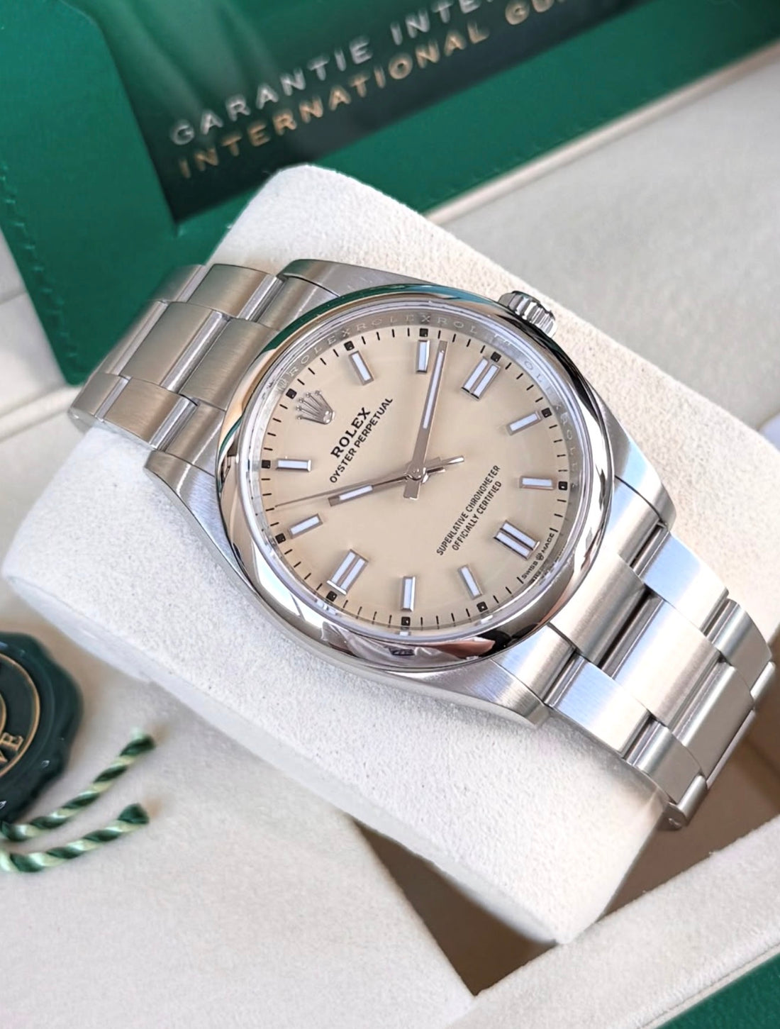 Rolex Oyster Perpetual 36 reference 126000 with beige dial and Oyster bracelet extended, diagonal front view