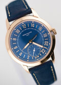 Patek Philippe 24-Hour Travel Time 5224R-001 in rose gold with blue dial and blue calfskin strap, three-quarter front product view