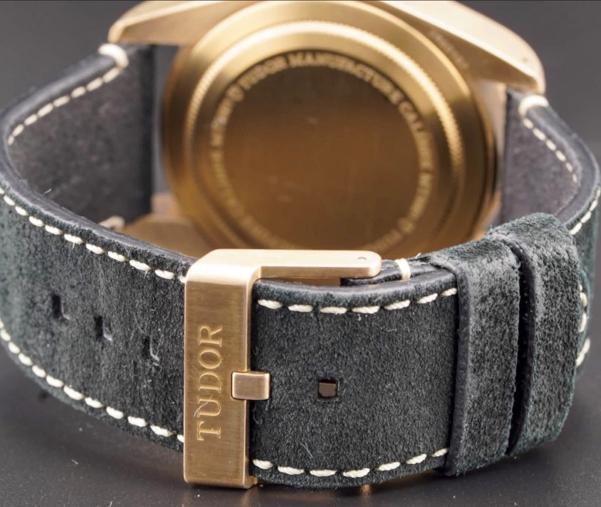 Tudor Black Bay Bronze M79250BA-0001, slate-gray dial and bezel with black nubuck strap, caseback, nubuck strap and bronze buckle view