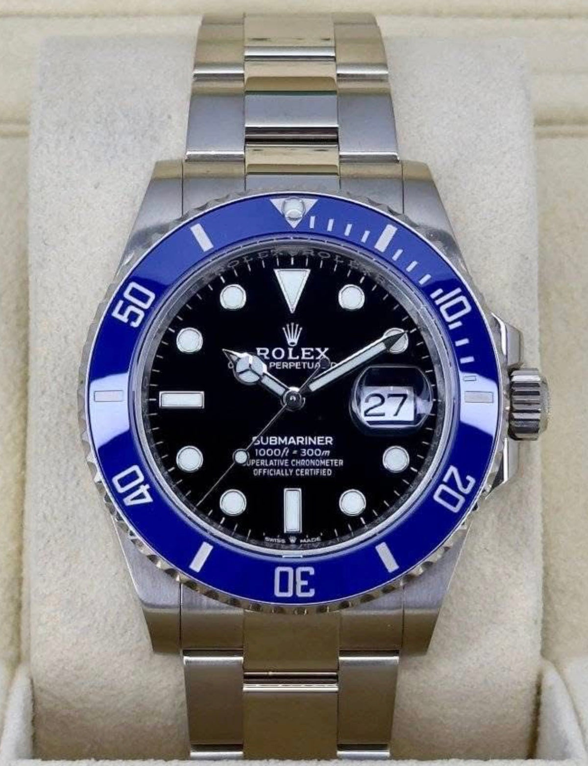 Rolex Submariner Date ref. 126619LB with black dial, blue Cerachrom bezel and white-gold Oyster bracelet, straight-on front view in presentation box