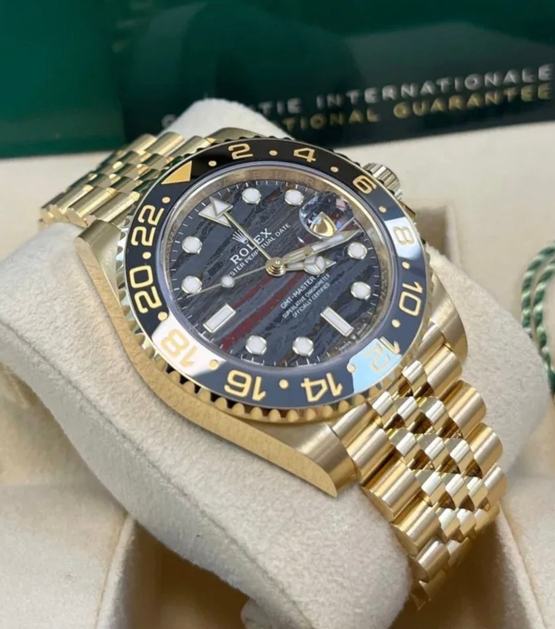 Rolex GMT-Master II 126718GRNR Tiger Iron dial on yellow-gold Jubilee bracelet, three-quarter view