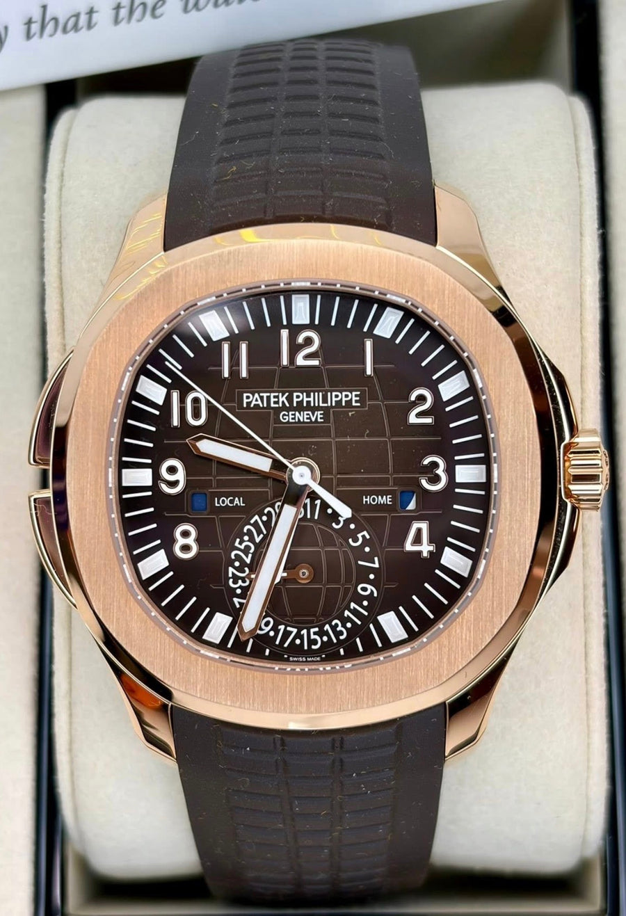 Patek Philippe Aquanaut Travel Time 5164R-001 with brown dial and composite strap, angled front close-up