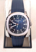 Patek Philippe Aquanaut 5168G-001 in white gold with blue embossed dial and blue composite strap, straight-on front view in the presentation box