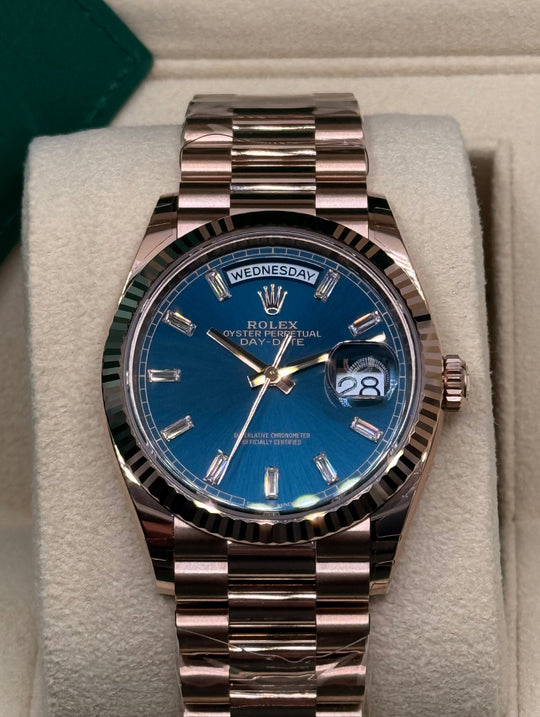 Rolex Day-Date 36 128235 front view with blue-green diamond dial, fluted bezel and Everose-gold President bracelet