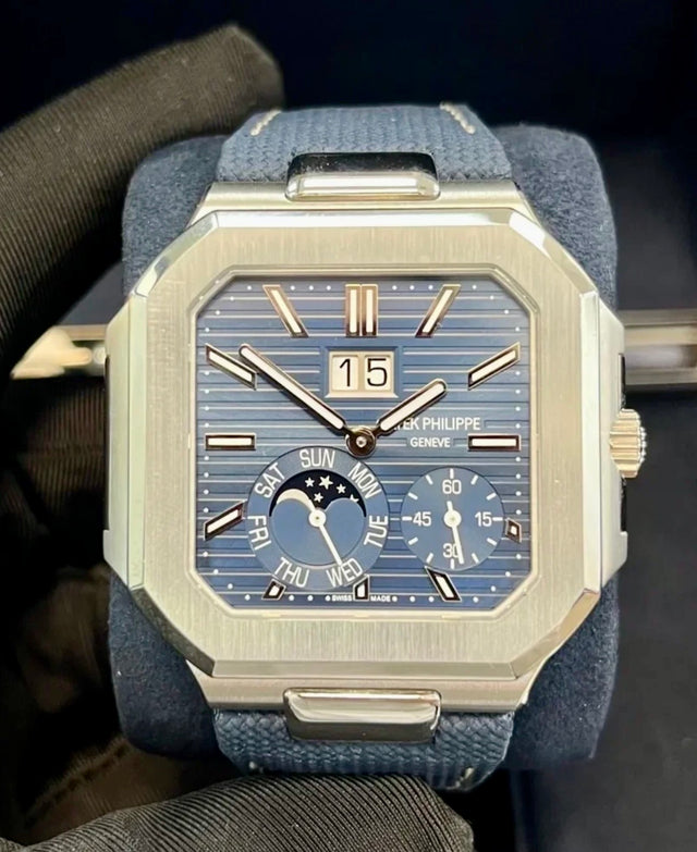 Patek Philippe Cubitus 5822P-001 in platinum, straight-on view of the blue dial with grand date, day, moon phases and small seconds