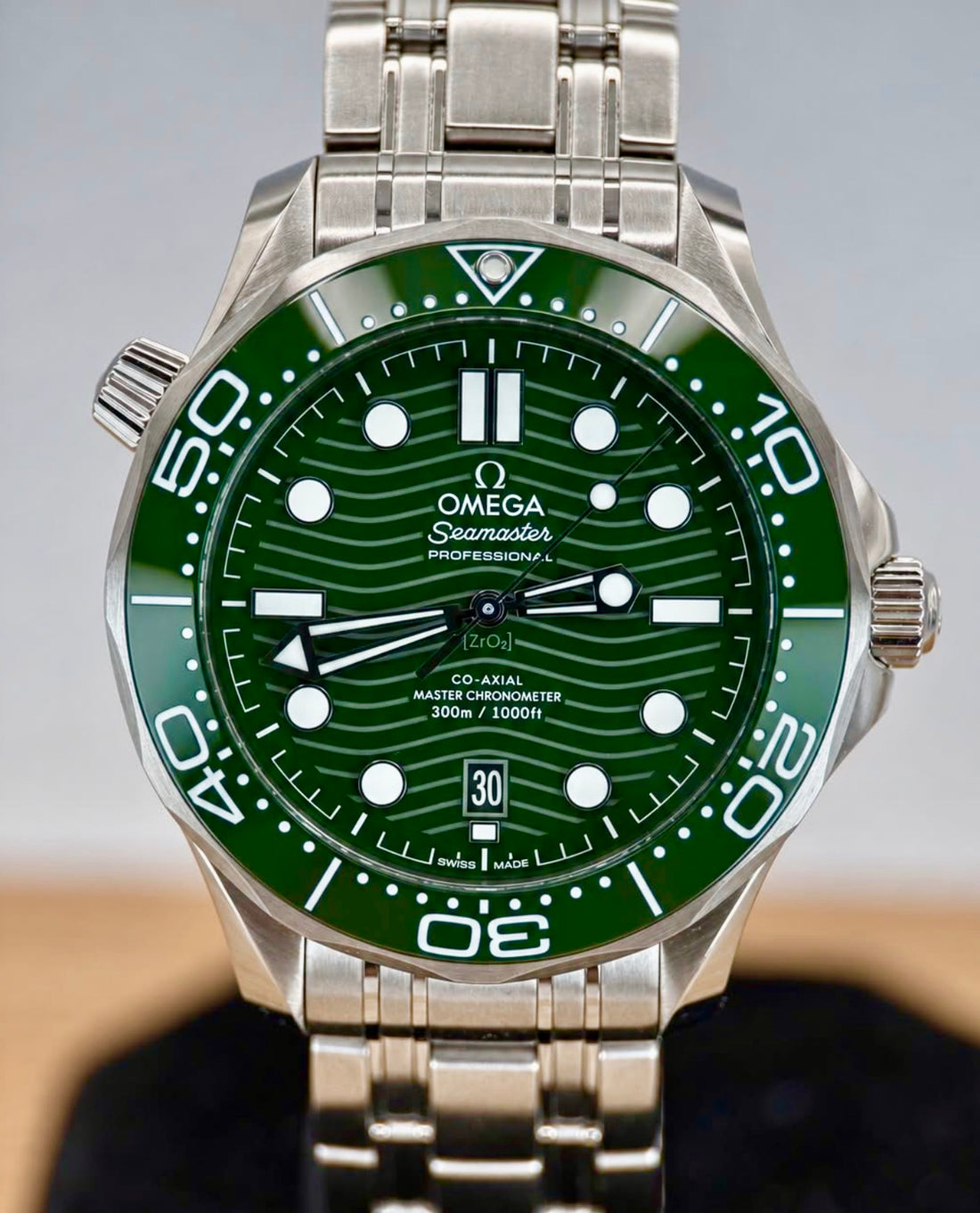 OMEGA Seamaster Diver 300M 210.30.42.20.10.001 — green wave dial and green bezel on steel bracelet, front view