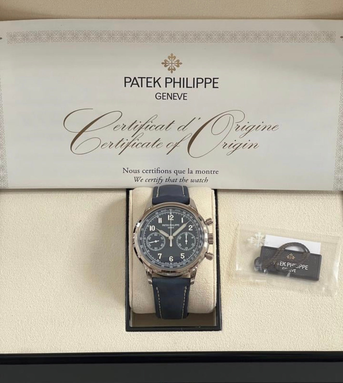 Patek Philippe Chronograph 5172G-001 in white gold with blue dial and blue calfskin strap, front view in the presentation box