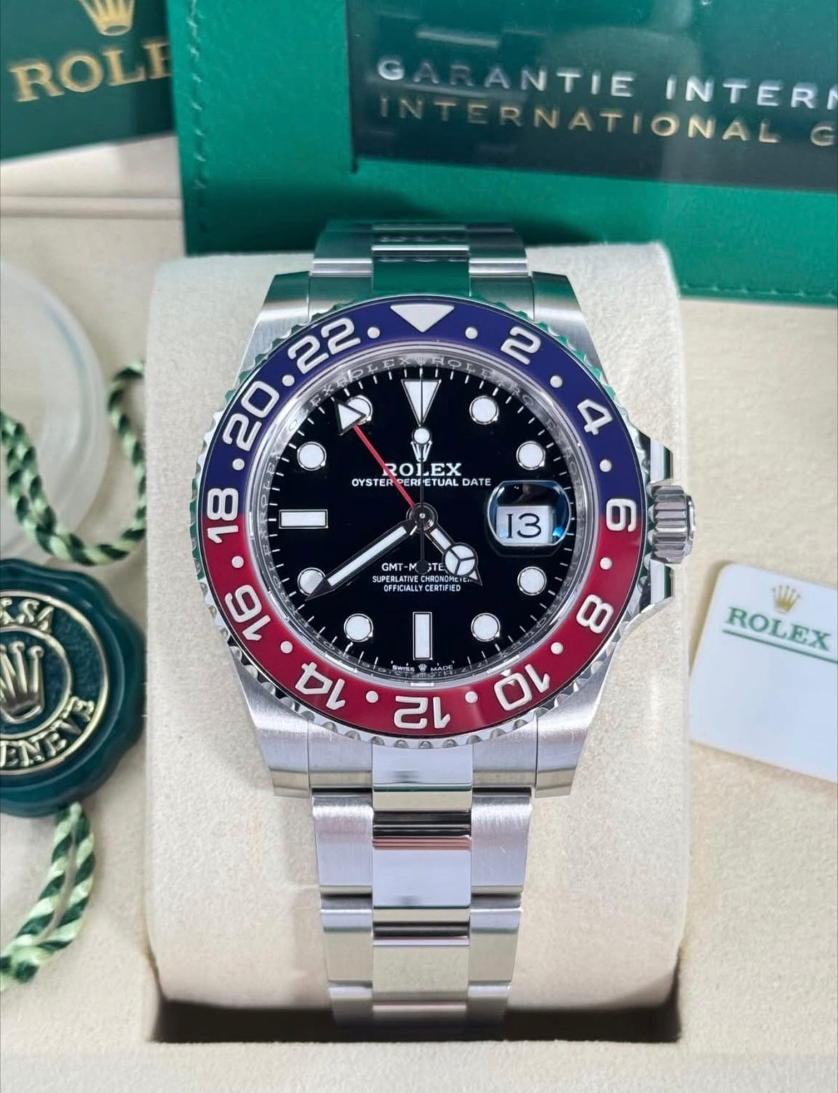 Rolex GMT-Master II ref. 126710BLRO with black dial, red-and-blue Cerachrom bezel and Oyster bracelet, front view in presentation box