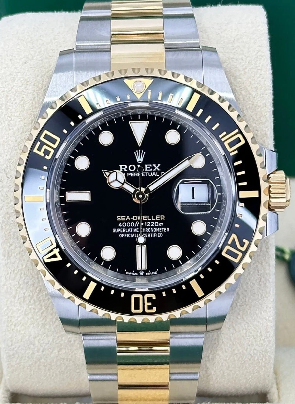 Rolex Sea-Dweller reference 126603 black dial and black bezel on Yellow Rolesor Oyster bracelet, straight-on front view