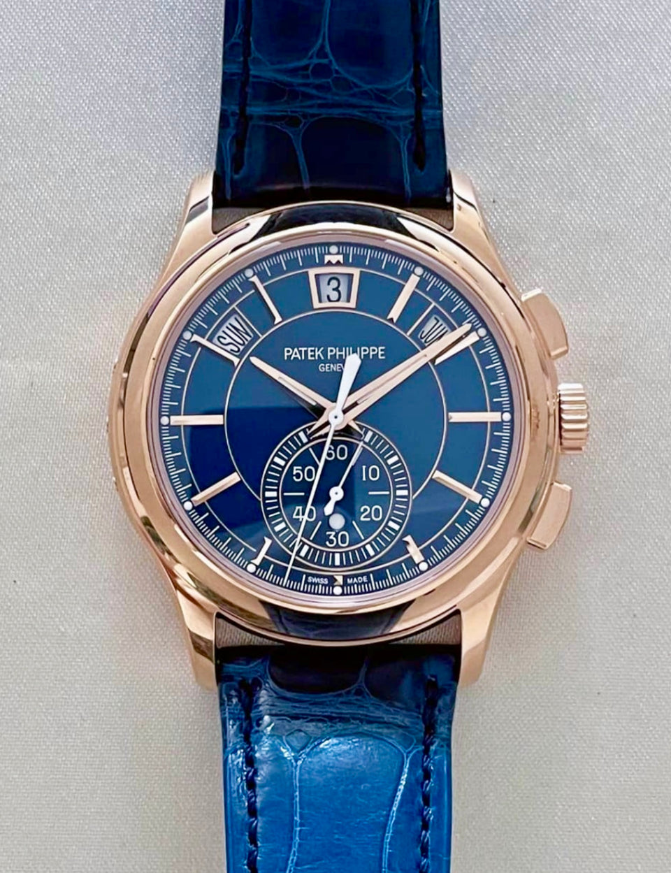 Patek Philippe 5905R-010 Annual Calendar Chronograph front view with blue dial, rose-gold case and blue leather strap