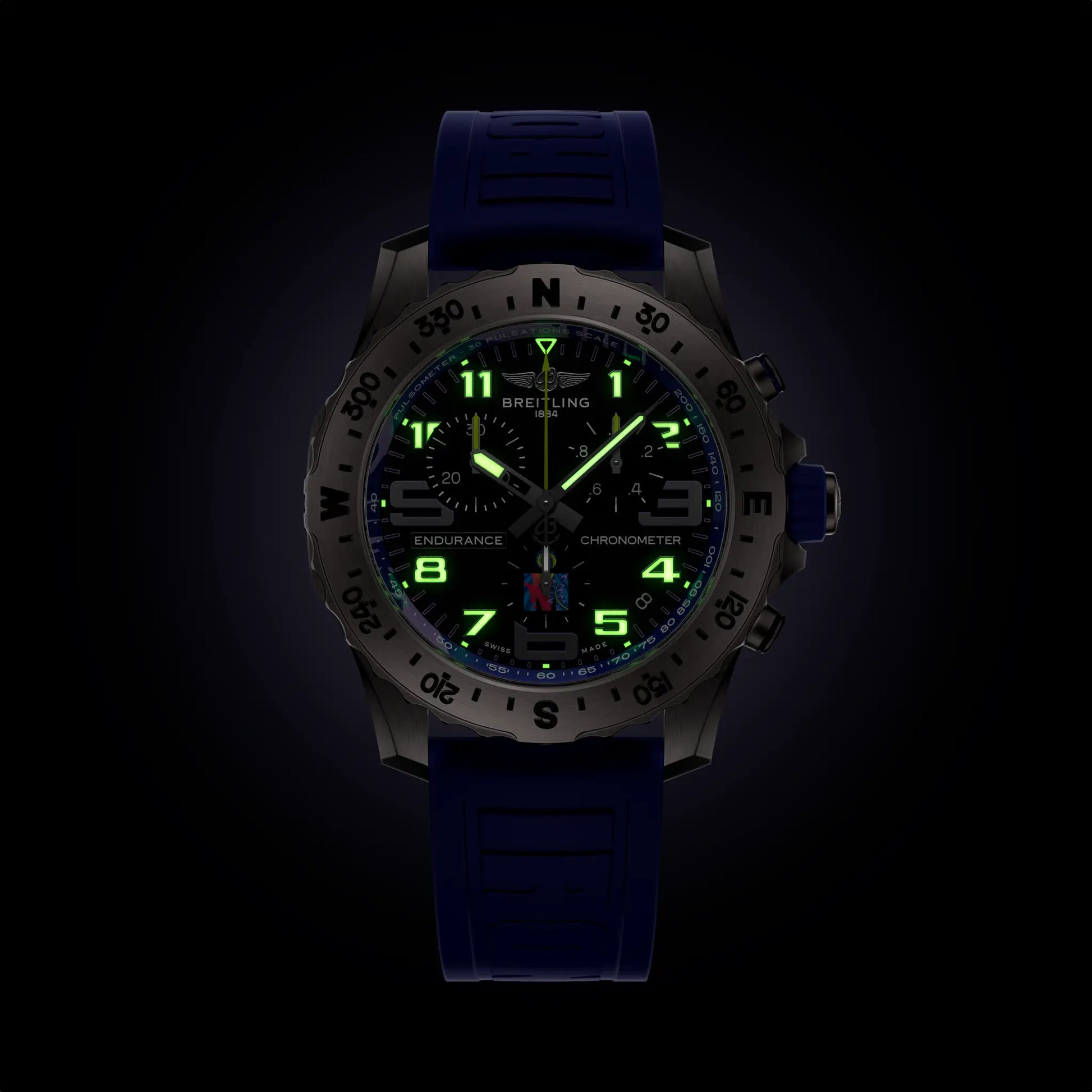Breitling Endurance Pro 44 IRONMAN® World Championship 2024 reference E823104A1M1S1 with Anthracite dial, Titanium case, rubber strap, illuminated dial view