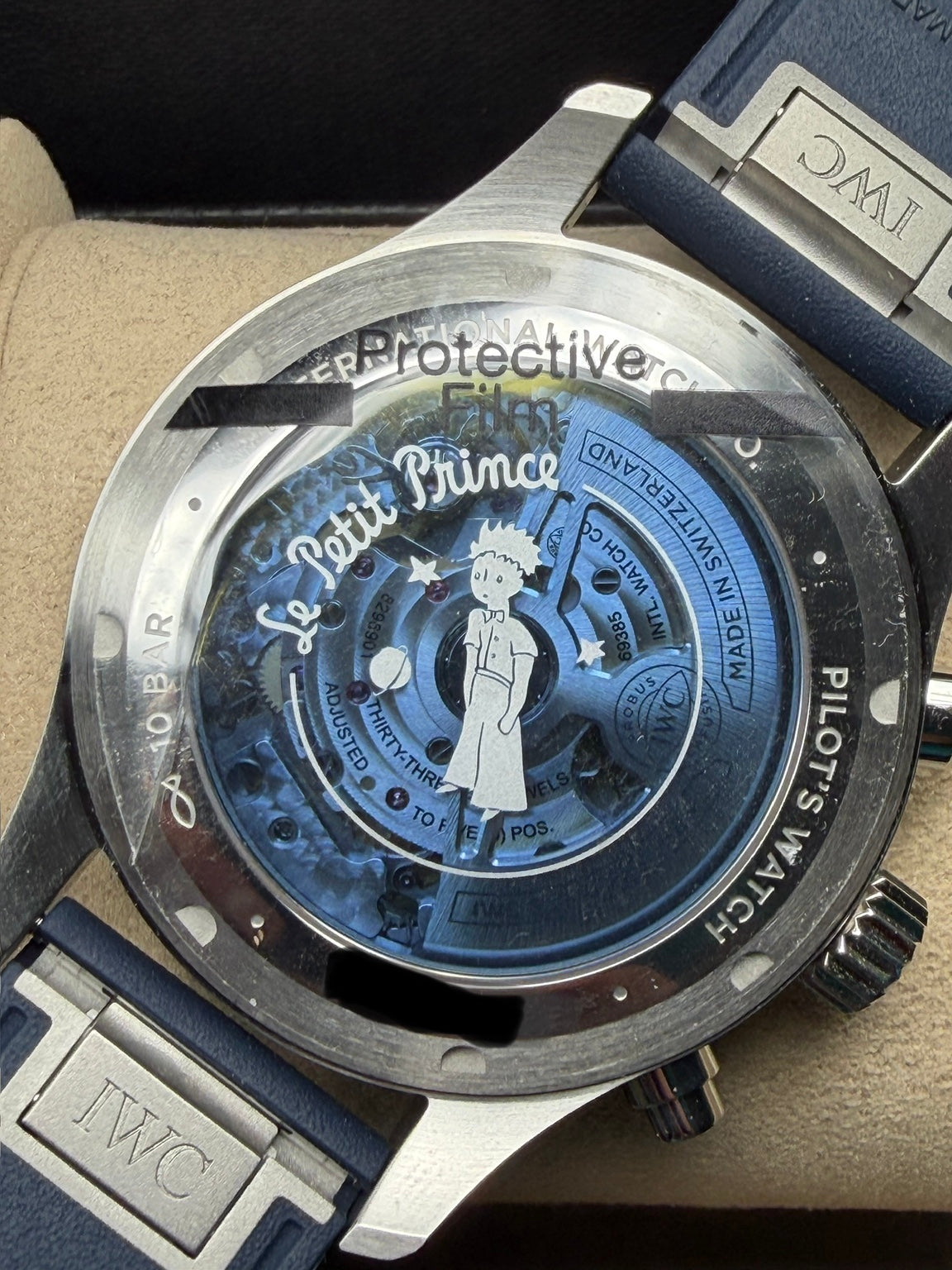 IWC IW378011 tinted sapphire caseback with Le Petit Prince artwork