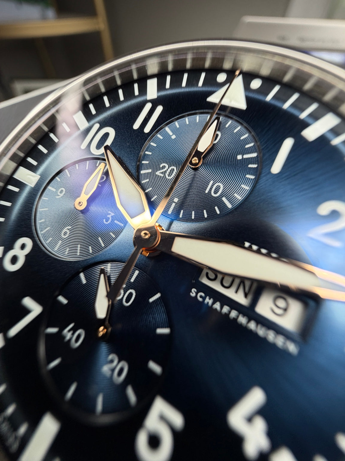 IWC IW378011 blue dial, gold-plated hands and chronograph subdials macro view