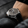 Breitling Premier B21 Chronograph Tourbillon 42 Gaston Breitling reference JB2120A61B1P1 with Anthracite dial, 18k white gold case, alligator strap, on-wrist view
