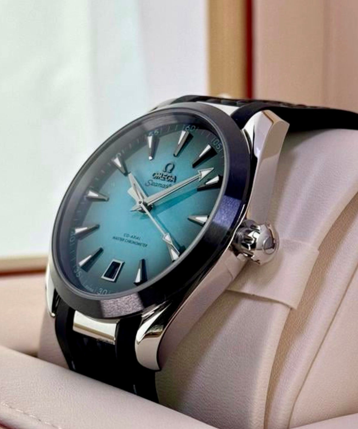 Omega Aqua Terra 41mm 220.32.41.21.03.001, crown-side view of turquoise dial and polished steel case