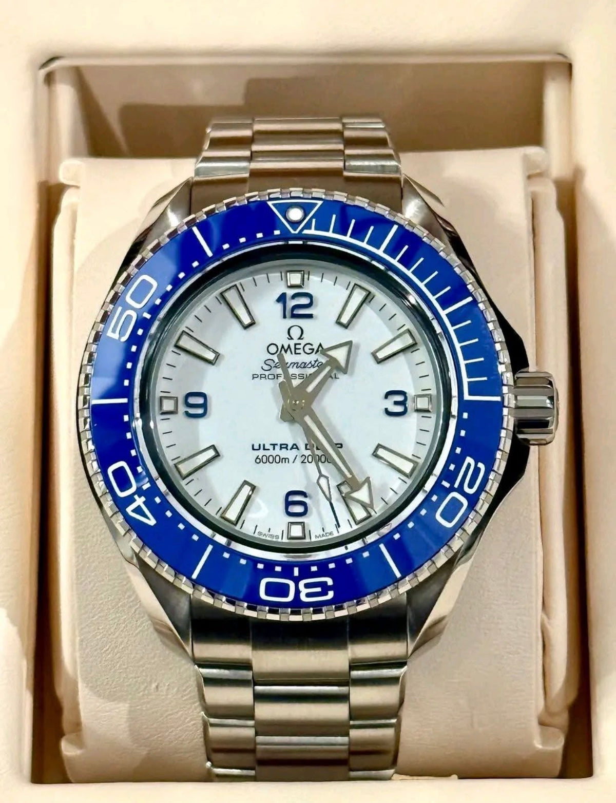 Omega Planet Ocean Ultra Deep 215.30.46.21.04.001 white dial and blue bezel, front view
