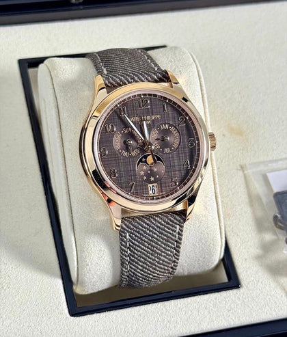 Patek Philippe Annual Calendar 4946R-001, rose gold case and chestnut shantung dial on a denim-pattern calfskin strap, front view
