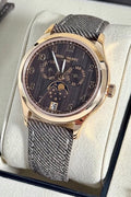 Patek Philippe 4946R-001 Annual Calendar, angled close-up of the chestnut dial, moon phases and rose gold case