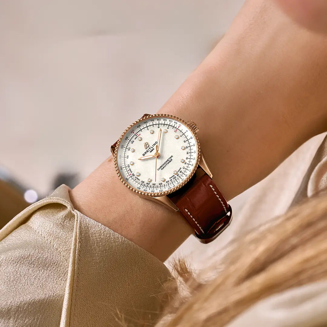 Breitling Navitimer Automatic 36 reference R17327211A1P1 with Mother-of-pearl dial, Small scale traceable 18K red gold case, alligator strap, on-wrist view