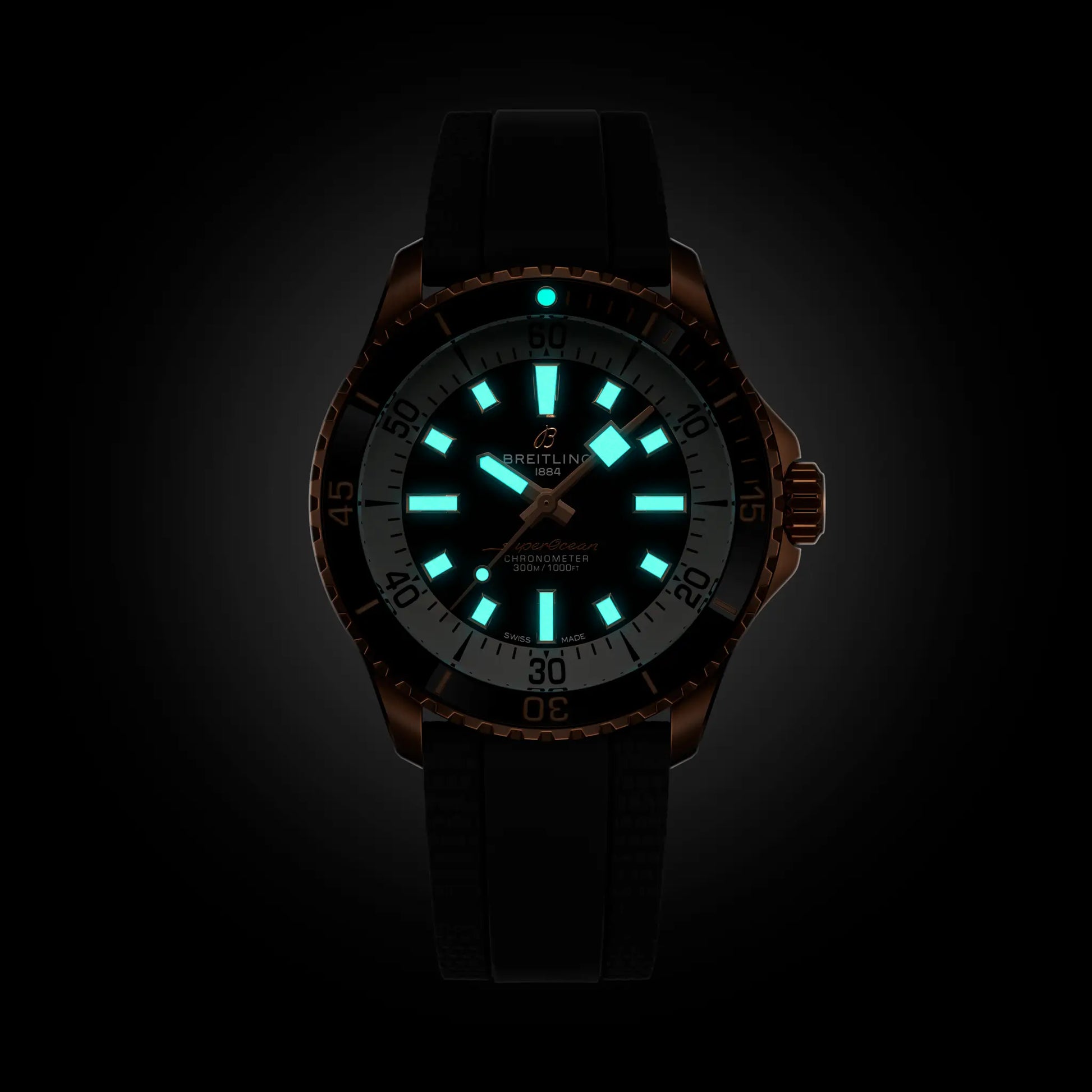 Breitling Superocean Automatic 42 reference R17375211B1S1 with Black dial, 18k red gold case, rubber strap, illuminated dial view