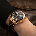Breitling Classic AVI Chronograph 42 P-51 Mustang reference R233801A1B1R1 with Black dial, 18k red gold case, bracelet, on-wrist view
