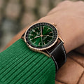Breitling Navitimer Automatic GMT 41 reference R32310251L1P1 with Green dial, Small scale traceable 18K red gold case, alligator strap, on-wrist view