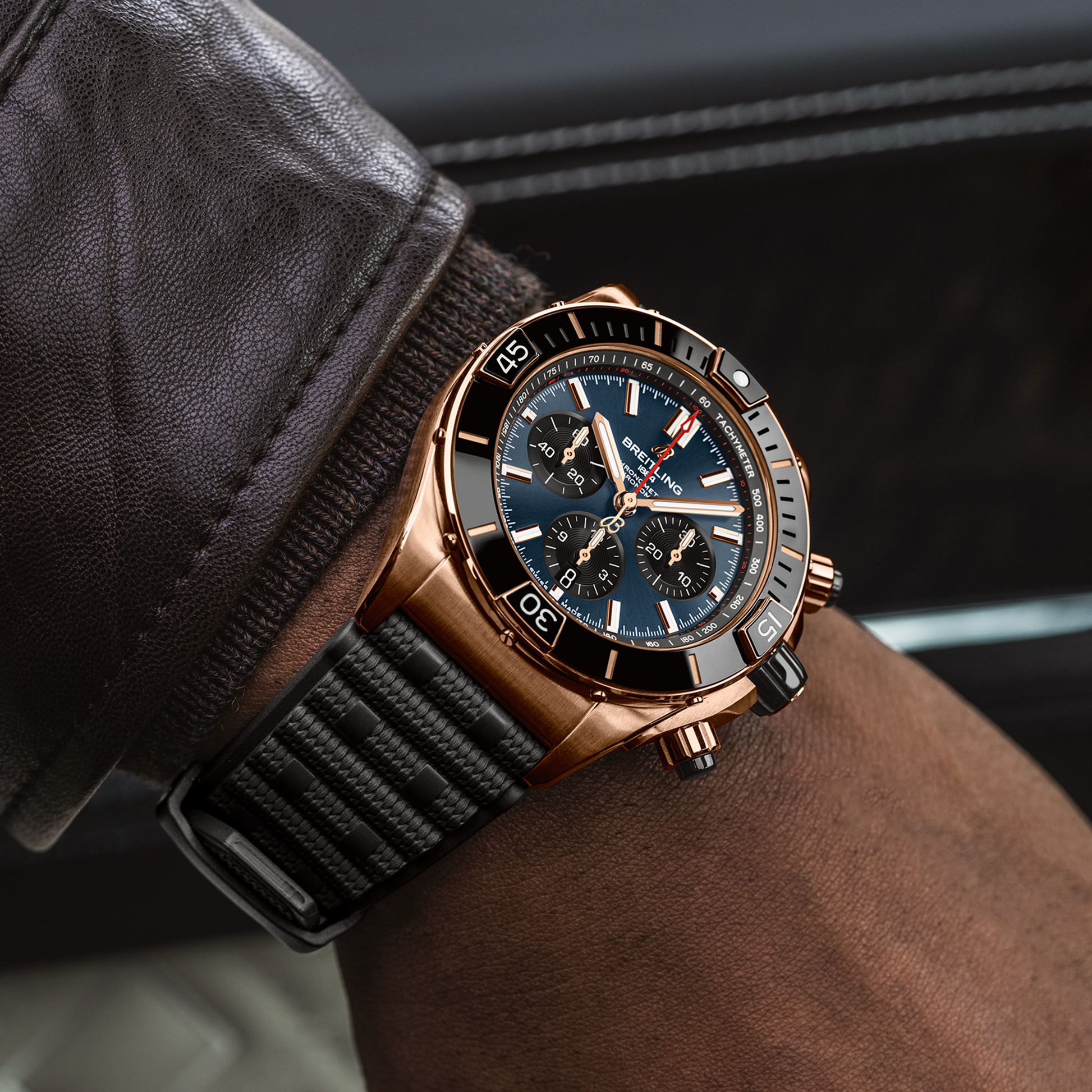 Breitling Super Chronomat B01 44 reference RB01362A1C1S1 with Blue dial, 18k red gold case, rubber strap, on-wrist view