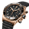 Breitling Super Chronomat B01 44 reference RB01365A1B1S1 with Black mother-of-pearl dial, 18k red gold case, rubber strap, three-quarter view
