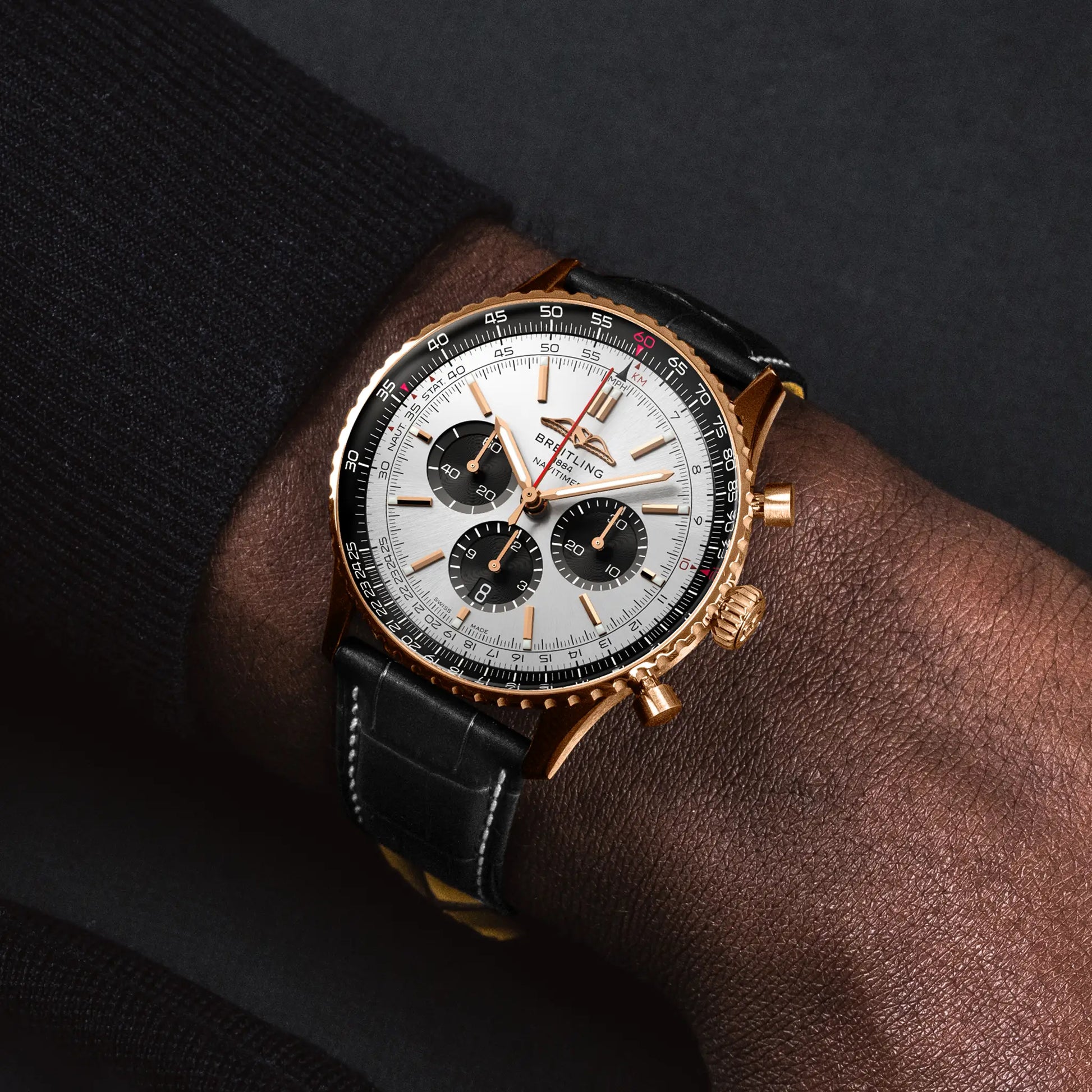 Breitling Navitimer B01 Chronograph 46 reference RB0137241G1P1 with Cream dial, 18k red gold case, black alligator strap, on-wrist view