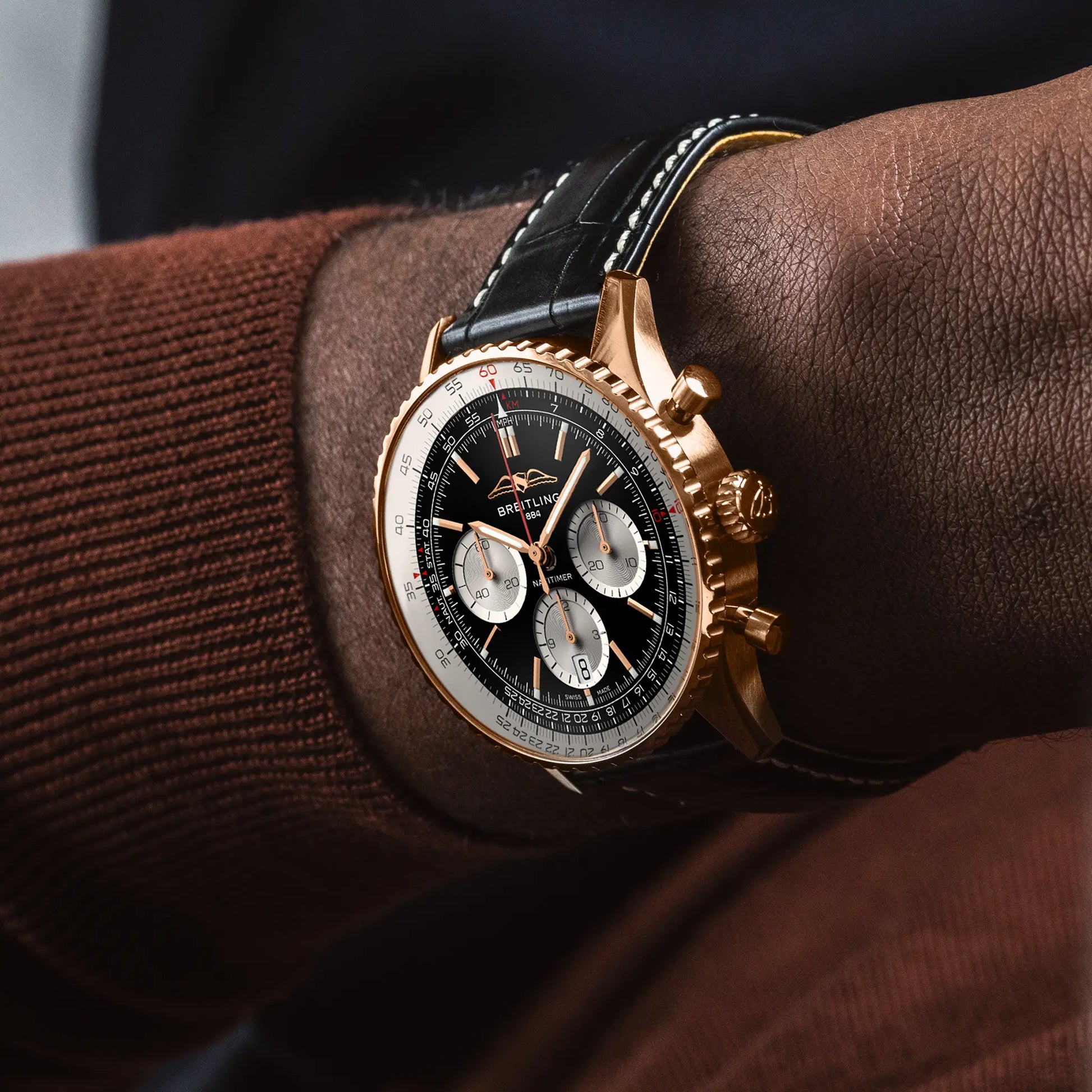 Breitling Navitimer B01 Chronograph 43 reference RB0138211B1P1 with Black dial, 18k red gold case, black alligator strap, on-wrist view