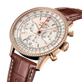 Breitling Navitimer B01 Chronograph 41 reference RB0139631G1P1 with Cream dial, 18k red gold (gem-set) case, alligator strap, three-quarter view