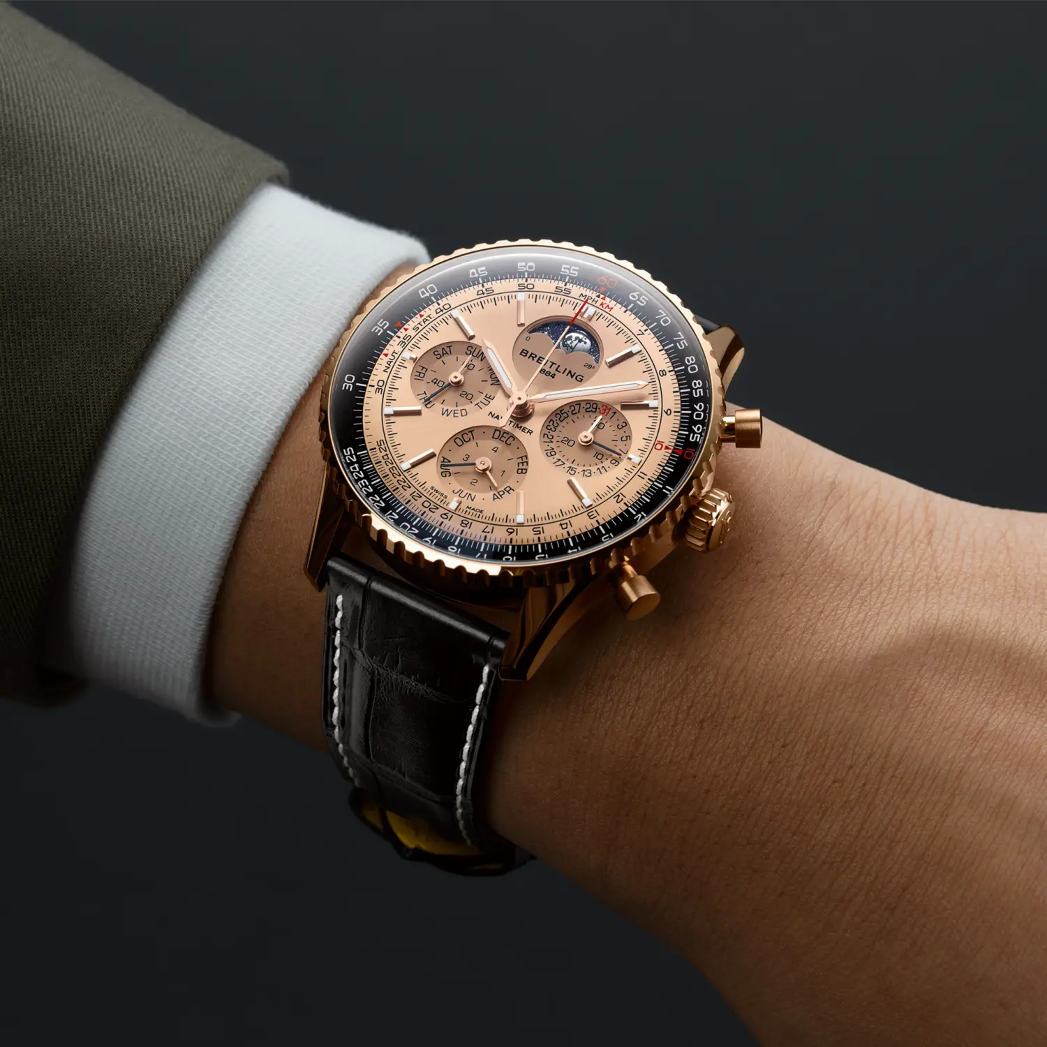 Breitling Navitimer B19 Chronograph 43 Perpetual Calendar 140th Anniversary reference RB19101A1H1P1 with Solid gold dial, 18k red gold case, alligator strap, on-wrist view