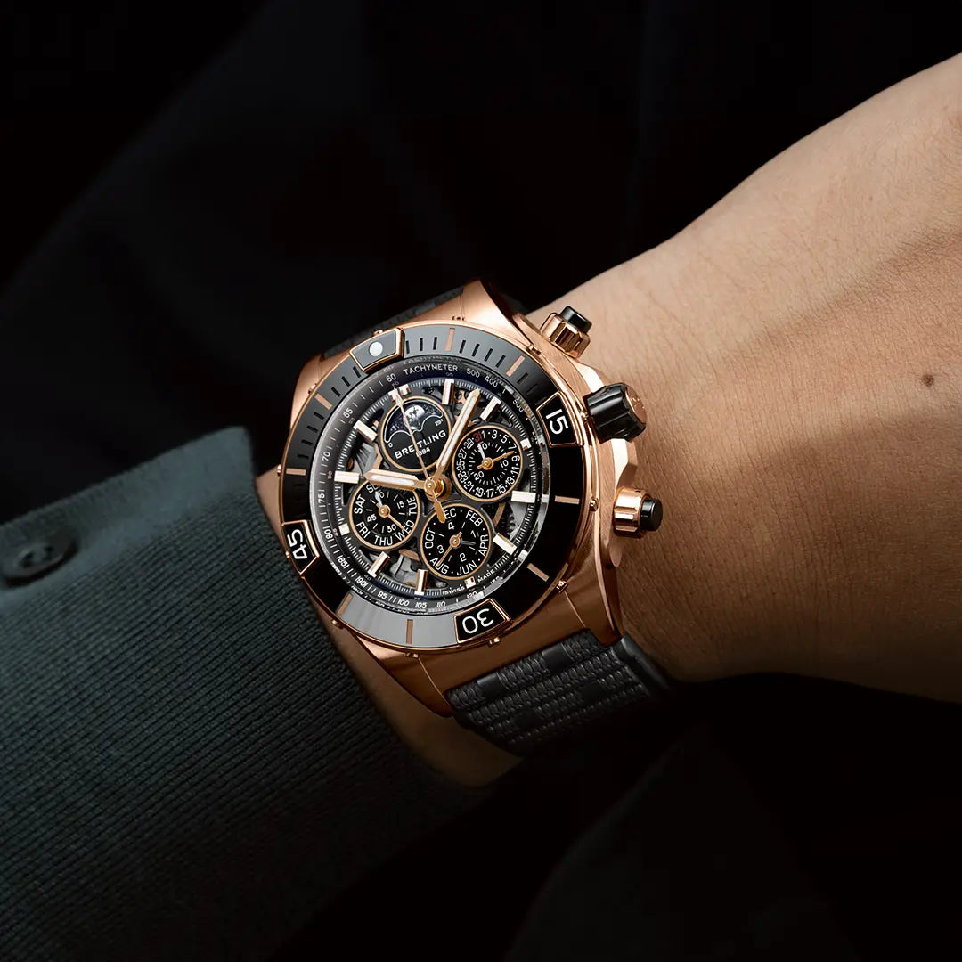 Breitling Super Chronomat B19 44 Perpetual Calendar 140th Anniversary reference RB19301A1G1S1 with Transparent dial, 18k red gold case, rubber strap, on-wrist view