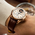Breitling Premier B21 Chronograph Tourbillon 42 Léon Breitling reference RB2120211G1P1 with Cream dial, 18k red gold case, alligator strap, on-wrist view