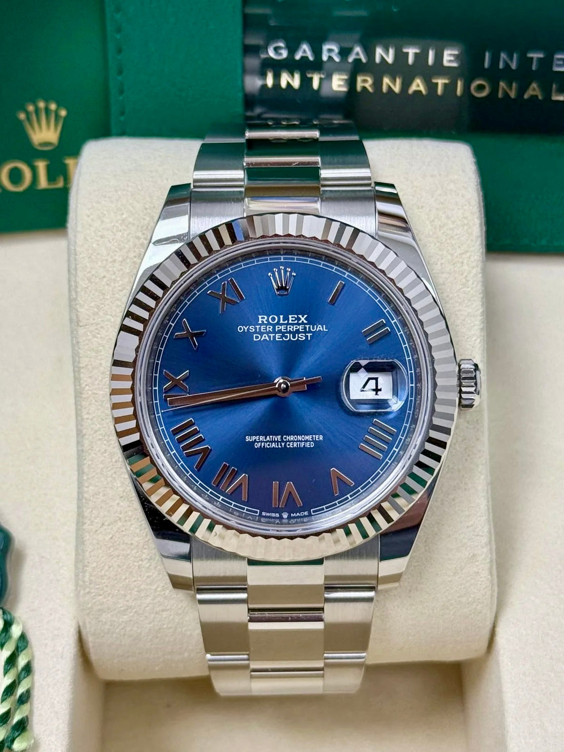 Unworn 2026 Rolex Datejust 41 126334-0037, new bright blue Roman dial, fluted bezel and Oyster bracelet — front dial view