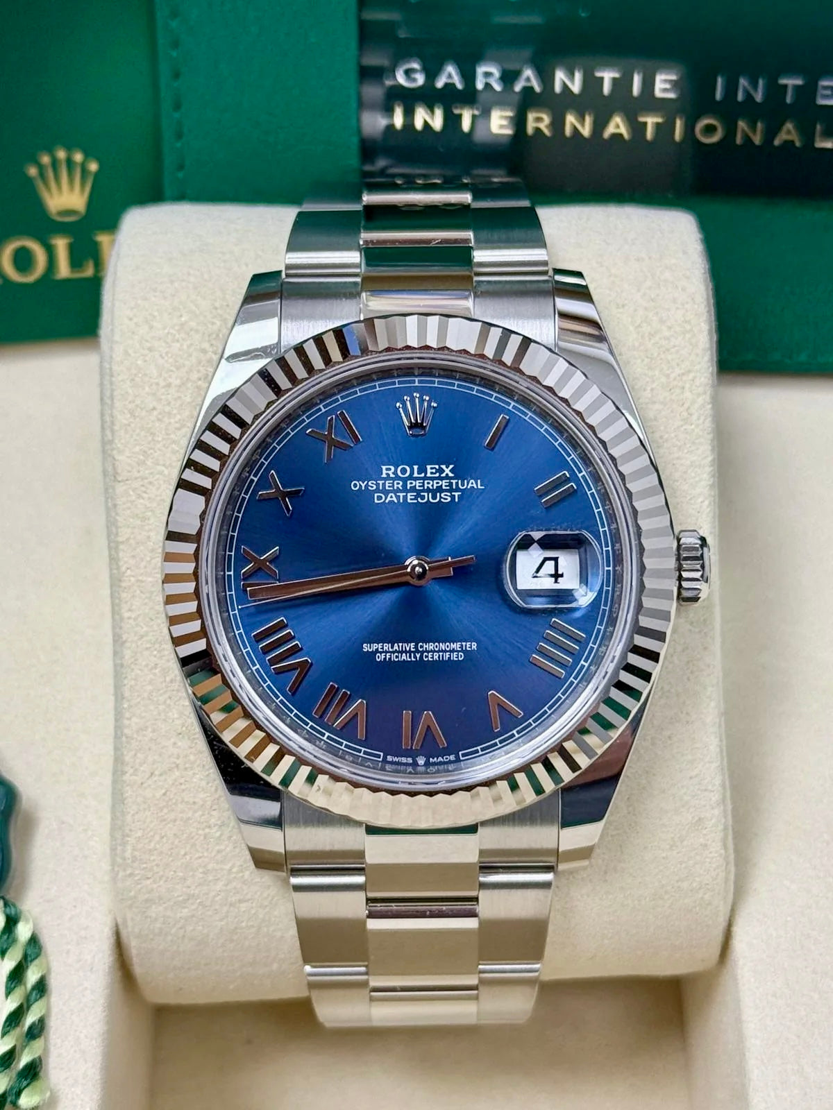 Unworn 2026 Rolex Datejust 41 126334-0037, new bright blue Roman dial, fluted bezel and Oyster bracelet — front dial view