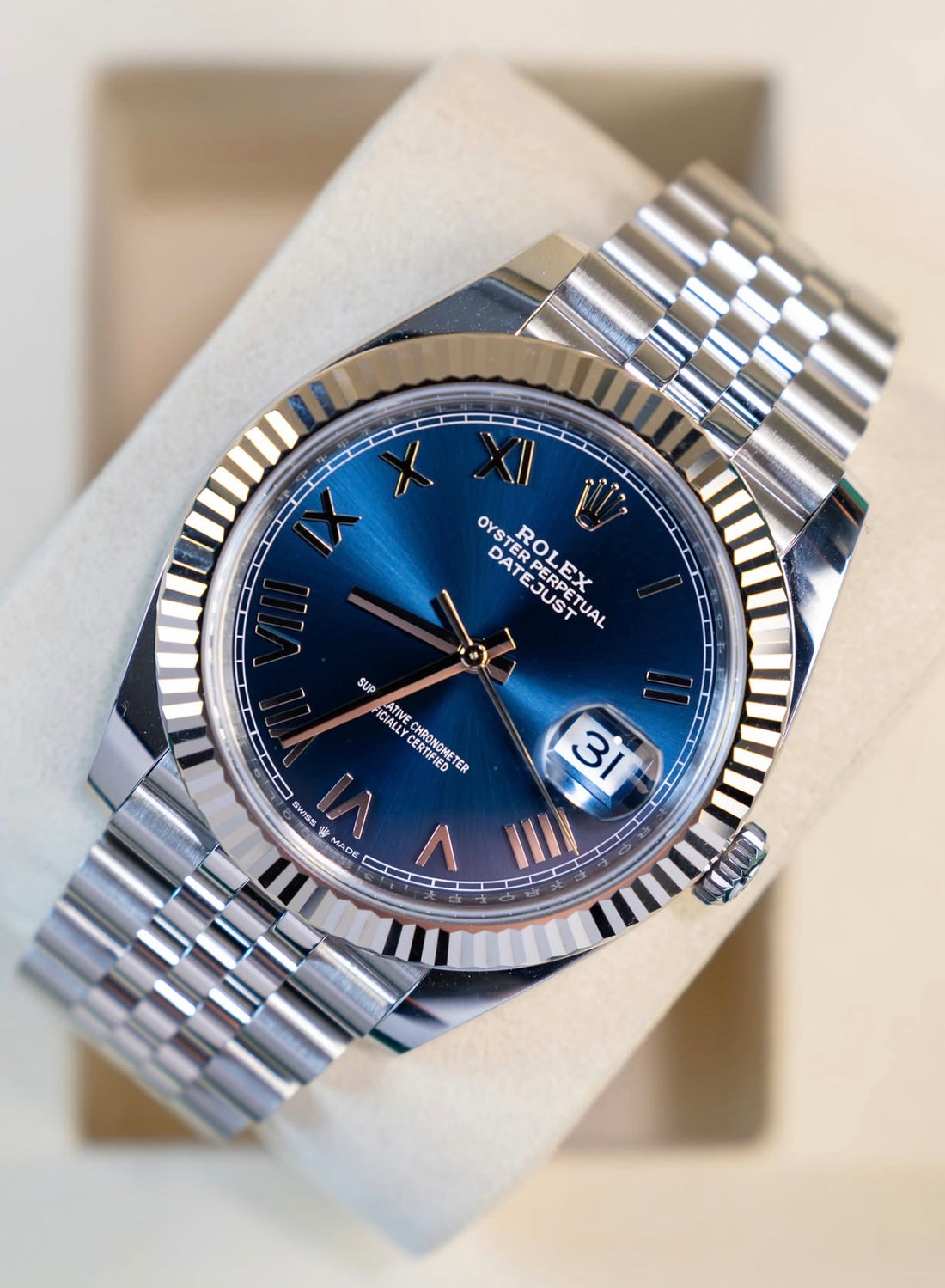 Unworn 2026 Rolex Datejust 41 126334-0038, bright blue Roman dial, white gold fluted bezel and Jubilee bracelet — dial close up
