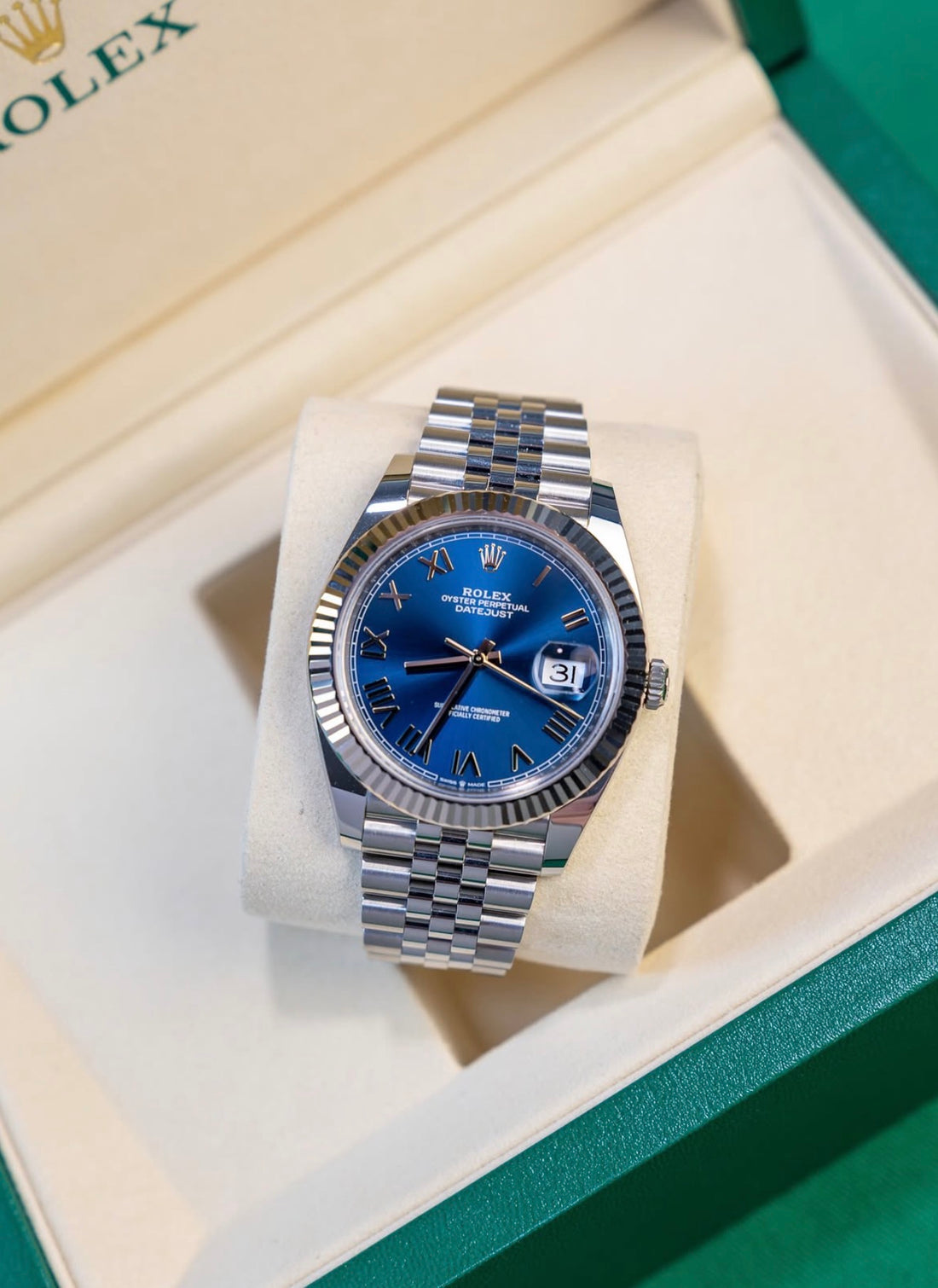 Unworn 2026 Rolex Datejust 41 126334-0038, bright blue Roman dial, white gold fluted bezel and Jubilee bracelet — front in box