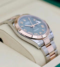 Rolex Datejust 41 126331 side profile showing its fluted Everose gold bezel and polished Oyster case