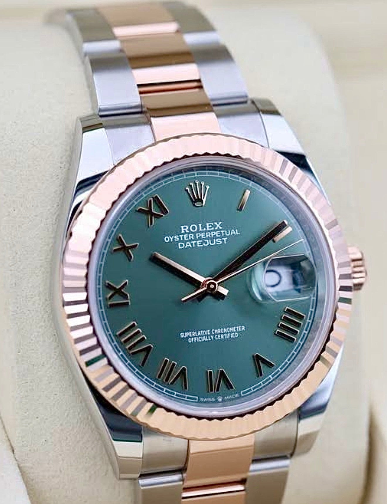 Rolex Datejust 41 green Roman dial 126331, alternate dial view with fluted bezel and Oyster bracelet