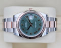 Rolex Datejust 41 126331 laid flat, showing the green Roman dial and two-tone Oyster bracelet