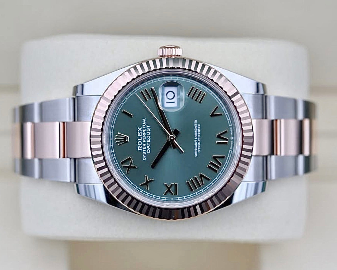Rolex Datejust 41 126331 laid flat, showing the green Roman dial and two-tone Oyster bracelet