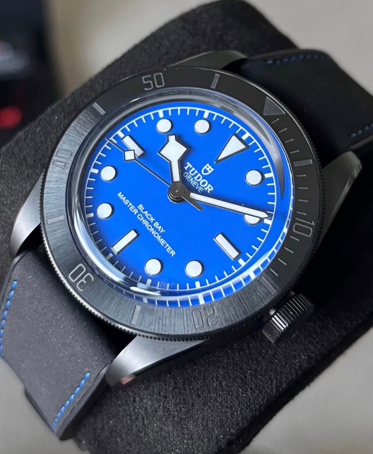 Tudor Black Bay Ceramic Blue M79210CNU-0007, angled view of the blue dial, ceramic bezel and hybrid strap