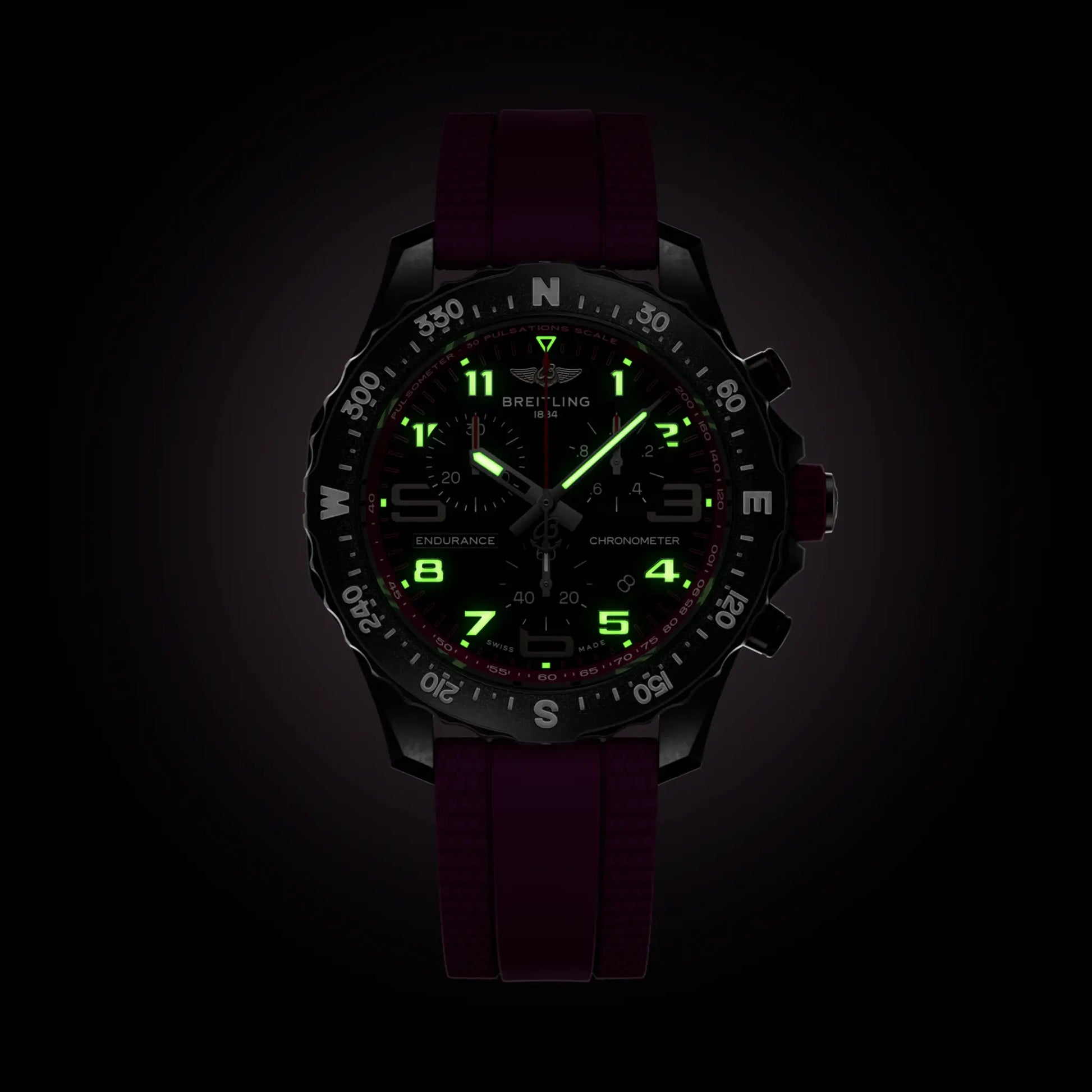 Breitling Endurance Pro 38 reference X83310F61B1S1 with Black dial, Breitlight® case, purple rubber strap, illuminated dial view