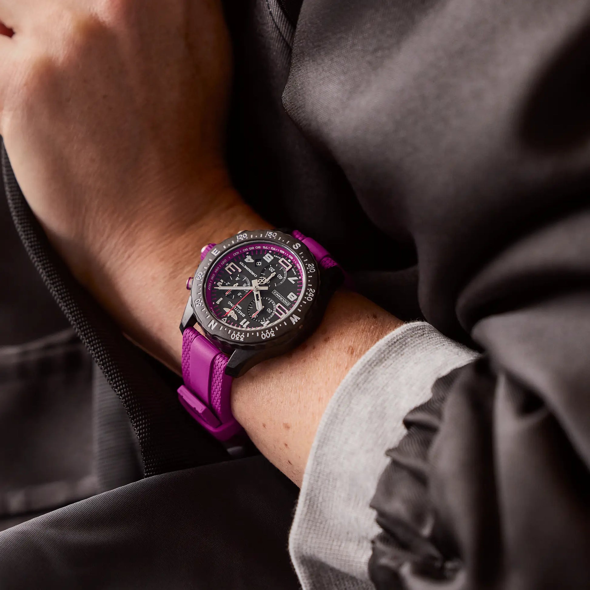 Breitling Endurance Pro 38 reference X83310F61B1S1 with Black dial, Breitlight® case, purple rubber strap, on-wrist view