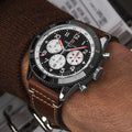 Breitling Super AVI B04 Chronograph GMT 46 Mosquito reference YB04451A1B1X1 with Black dial, Stainless steel case, brown calfskin strap, on-wrist view
