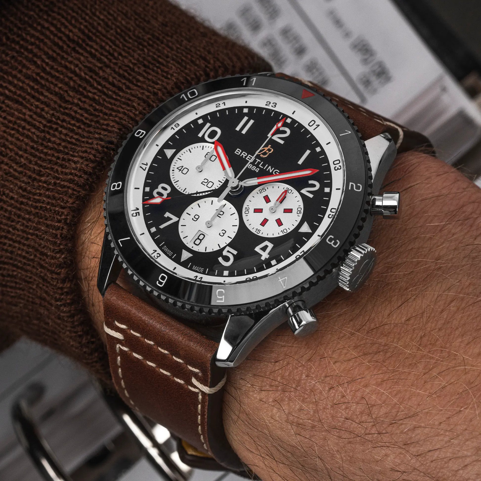 Breitling Super AVI B04 Chronograph GMT 46 Mosquito reference YB04451A1B1X1 with Black dial, Stainless steel case, brown calfskin strap, on-wrist view